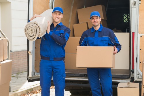 Loading household items into a mobile self storage unit in Neasden