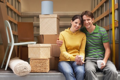 Packed moving boxes and wrapped furniture ready for collection