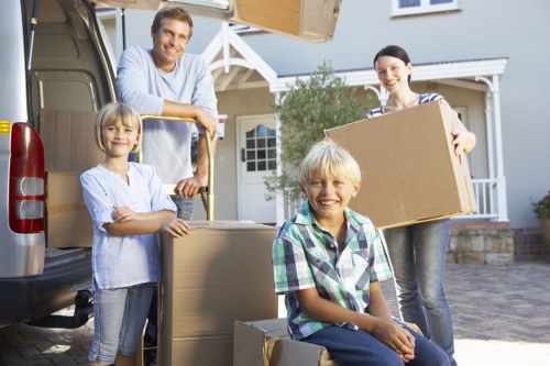 Local moving team handling furniture during a Neasden small removal